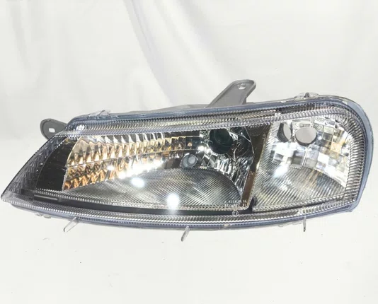 Farol Chevrolet Celta Mascara Cromada Lado Esquerdo 2000 ate 2006