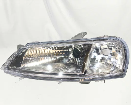 Farol Chevrolet Celta Mascara Cromada Lado Esquerdo 2000 ate 2006