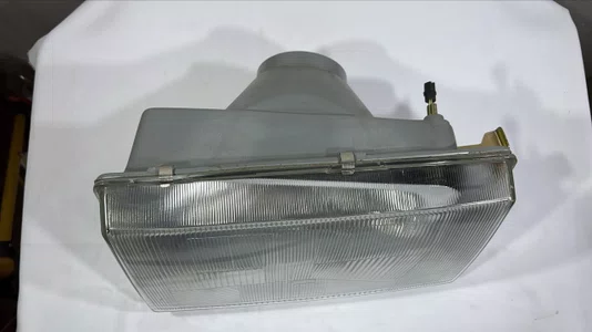 Farol Principal (Lado Esquerdo/Motorista)  Caminhoes Volvo NL (1987 a 1997)