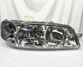 Farol Principal Fiat Palio / Siena / Strada Máscara Cromada, Carcaça Cinza Lado Direito de 2001 até 2003